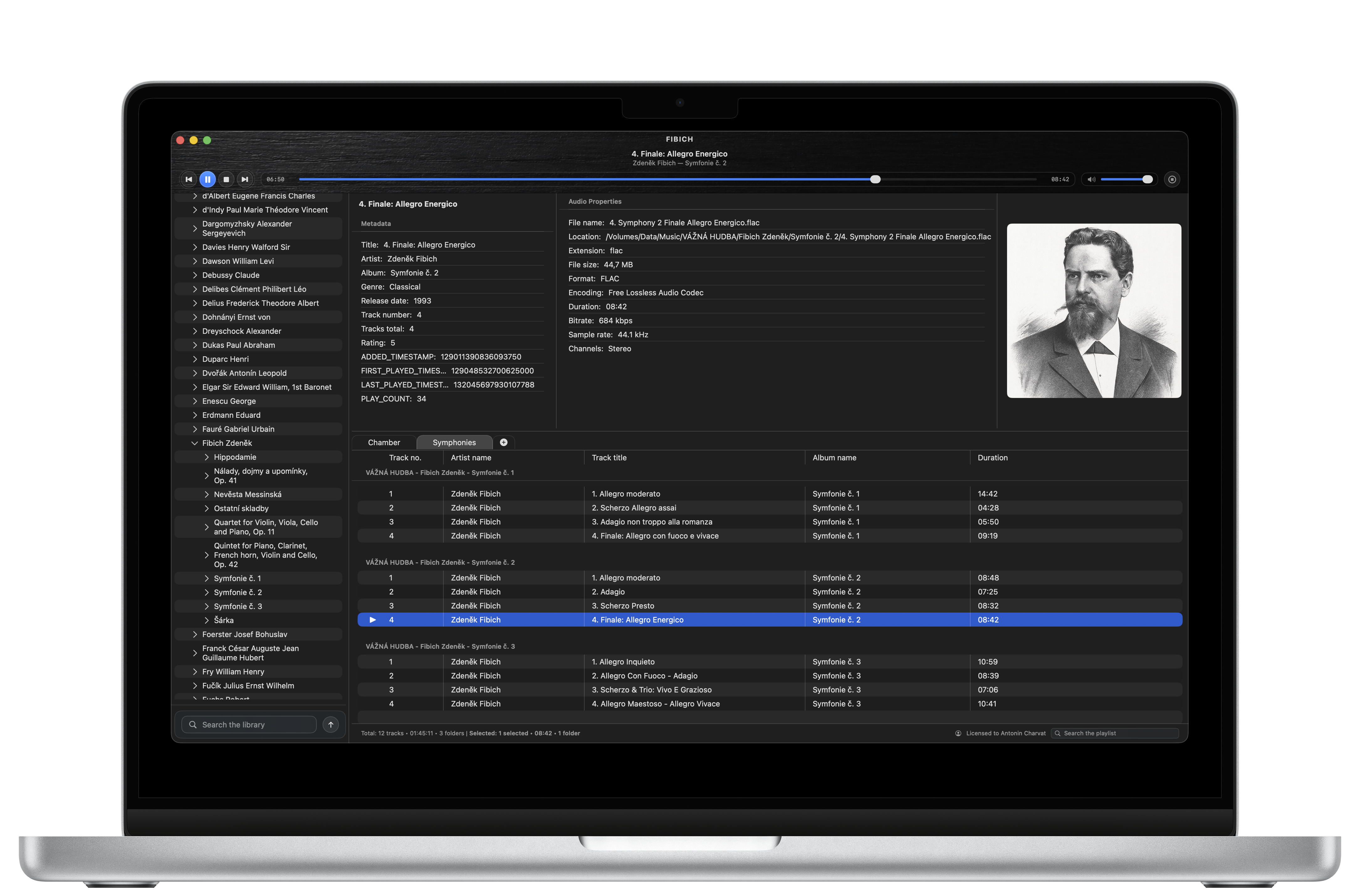 Fibich in dark mode on a MacBook, showing a music library, playlists, metadata, and album artwork